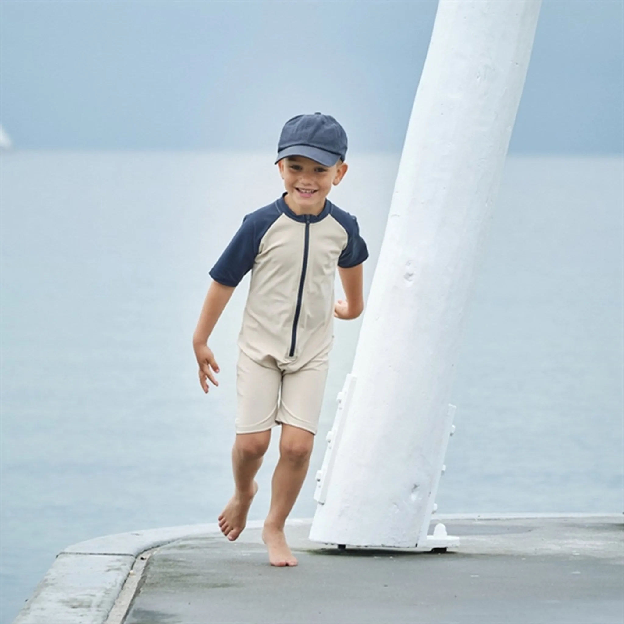 Petit Crabe Latte/Blue Multi Color Onesie with Zipper